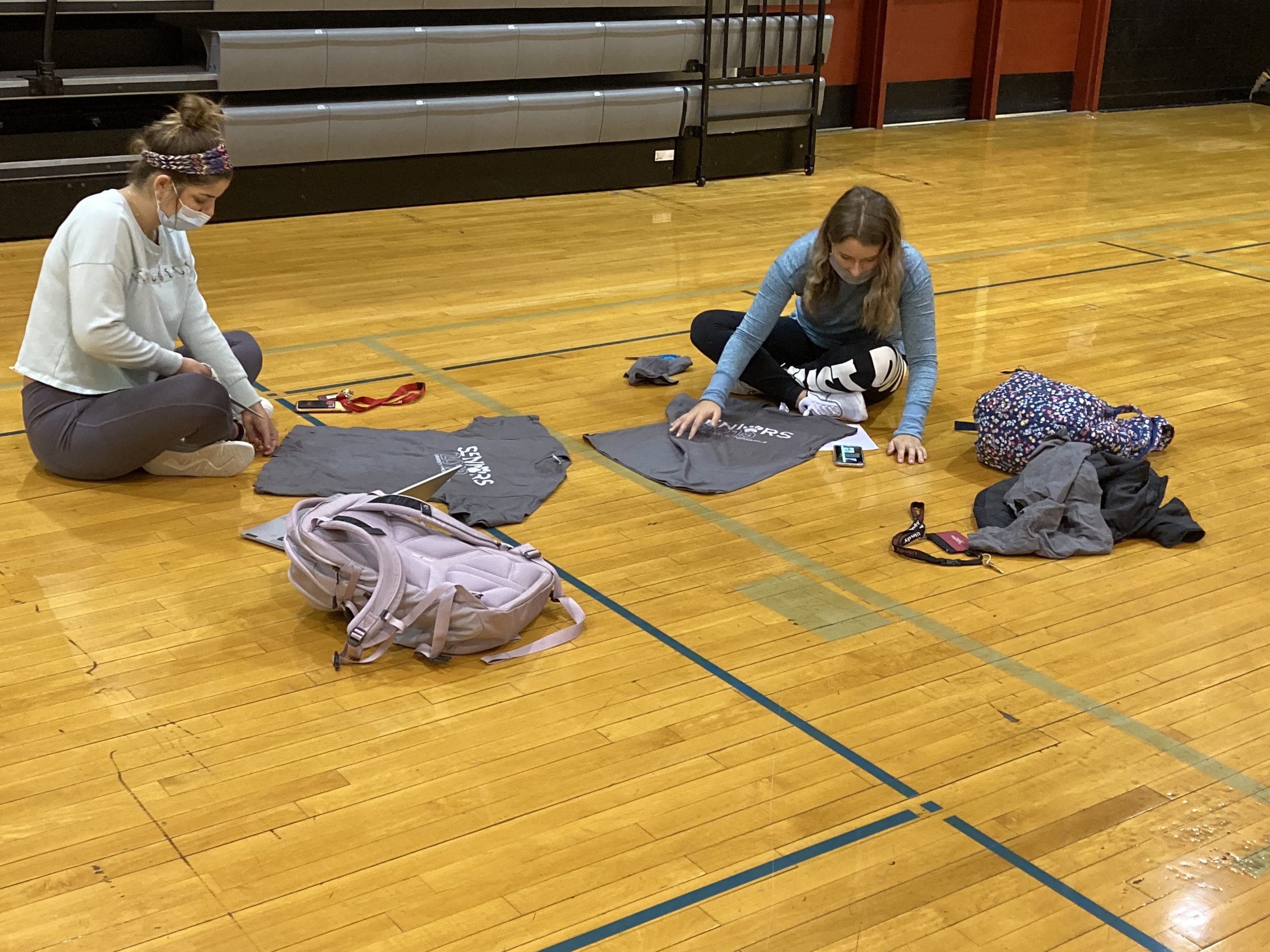 Students cutting t-shirts