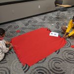 Students tying a no sew blanket